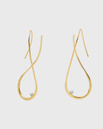 Sustainable and ethical unusual, lightweight gold plated hoop earrings with a freshwater pearl by London Independent Jewelry brand  Bar Jewellery. 