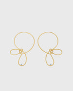 Sustainable and ethical unusual, lightweight gold plated hoop earrings with a freshwater pearl by London Independent Jewelry brand  Bar Jewellery. 