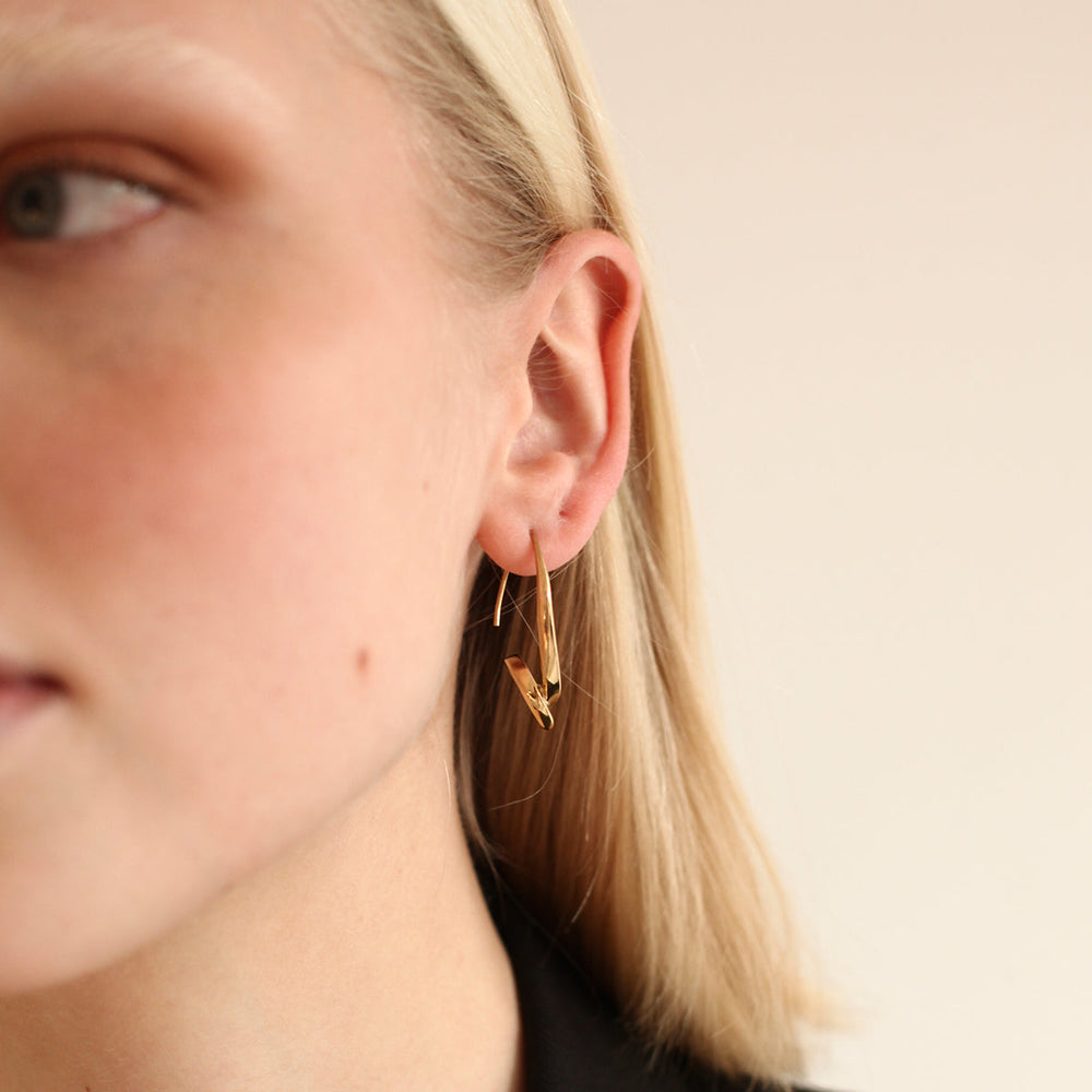 BAR Jewellery Sustainable Phi Earrings In Gold Drop Style, Placed On Ear