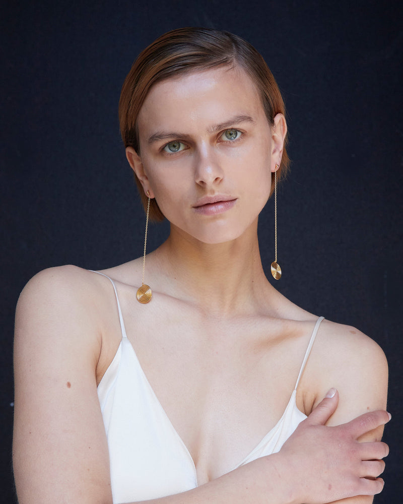 BAR Jewellery Sustainable Neverending Road Earrings In Gold Drop Style, Placed On Ear