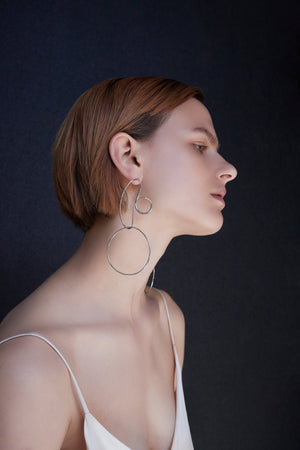 BAR Jewellery Sustainable Opposing Forms Earrings In Silver Drop Style, Placed On Ear