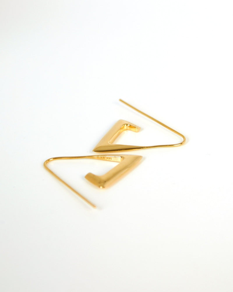 
            
                Load image into Gallery viewer, BAR Jewellery Sustainable Para Earrings In Gold Drop Style, Placed On Ear
            
        